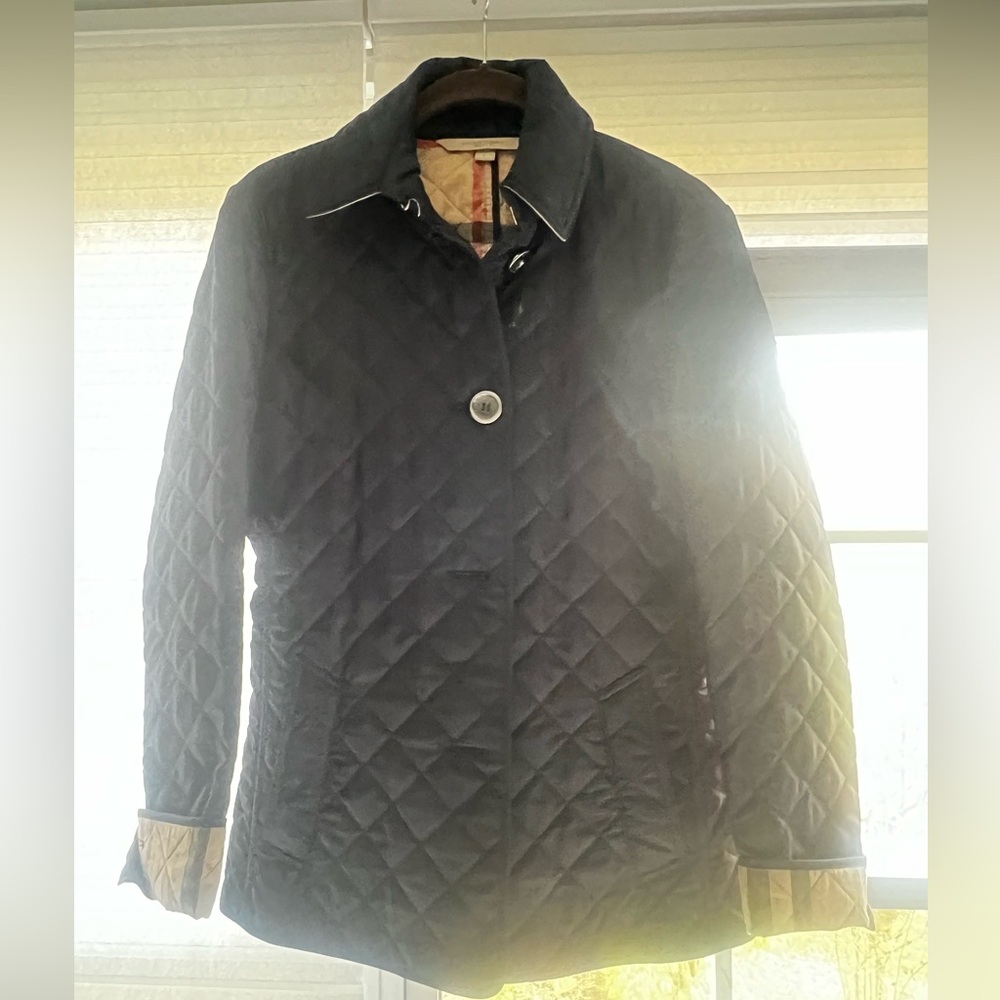black Burberry Brit diamond quilted jacket with a check lining.